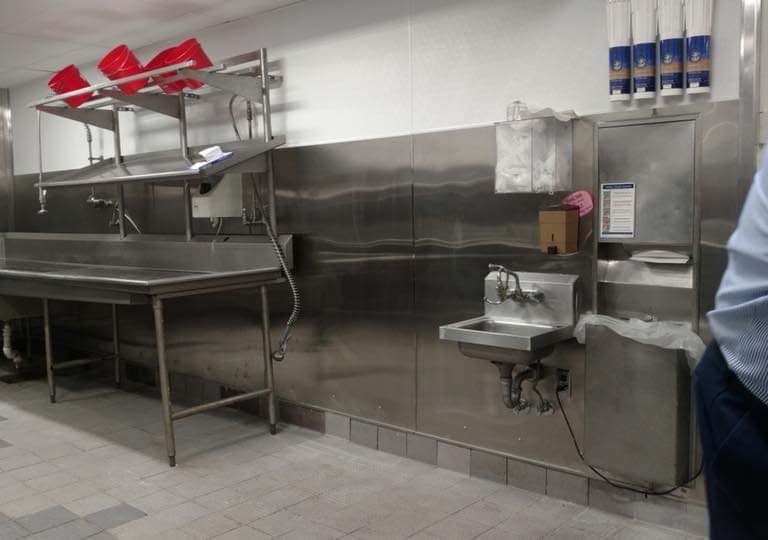 Custom stainless steel counters and work tables fabricated for a commercial kitchen